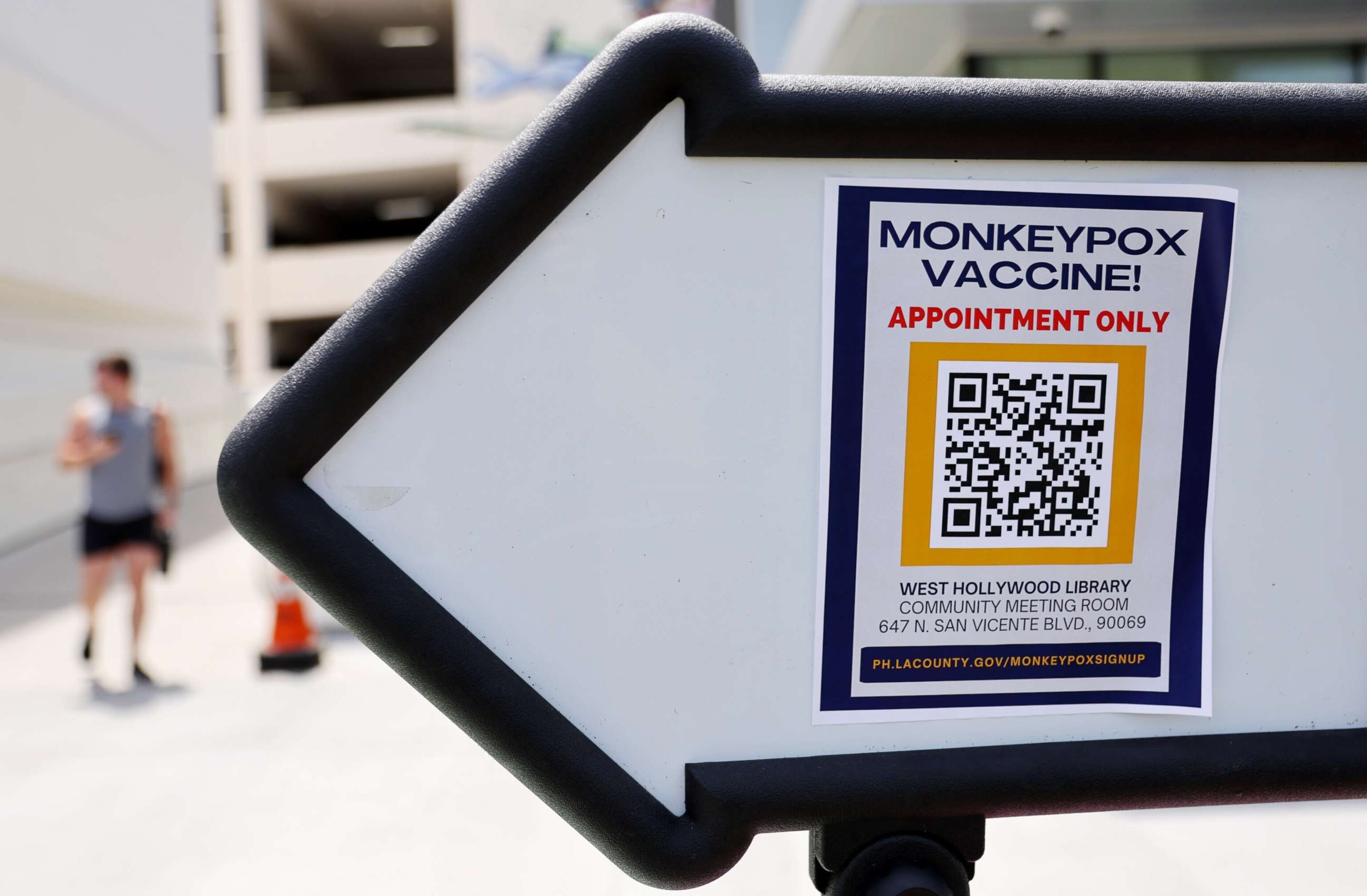 PHOTO: A sign directs people toward a pop-up monkeypox vaccination clinic which opened today by the Los Angeles County Department of Public Health at the West Hollywood Library on Aug. 3, 2022, in West Hollywood, Calif.
