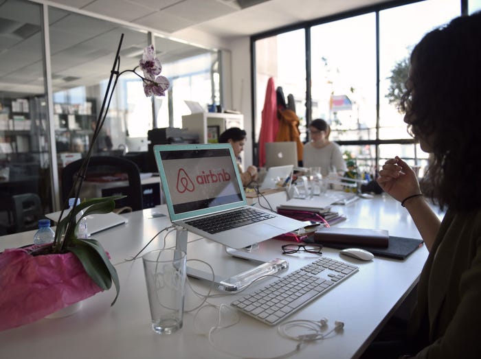 Employees of online lodging service Airbnb work in the Airbnb offices in Paris.