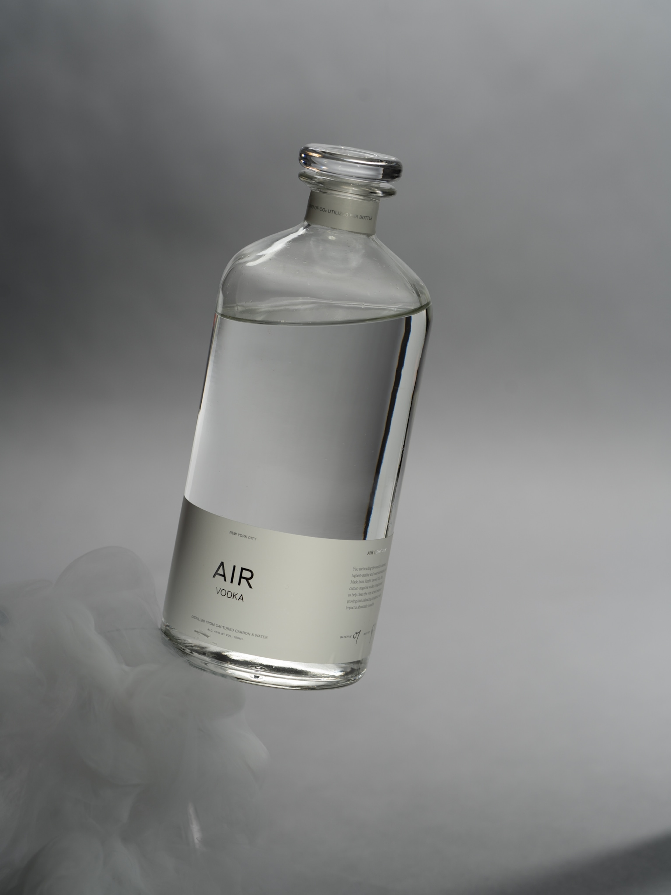 Clear glass bottle with Air vodka label.
