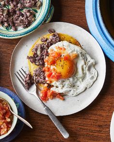 Huevos rancheros is a popular breakfast in Mexico. This hearty dish of black beans on a fried corn tortilla, topped with a fried egg and tomato salsa is perfect for a weekend breakfast or brunch, lunch or supper. Spicy, Cooking, Foods, Salsa, Huevos Rancheros, Supper, Food