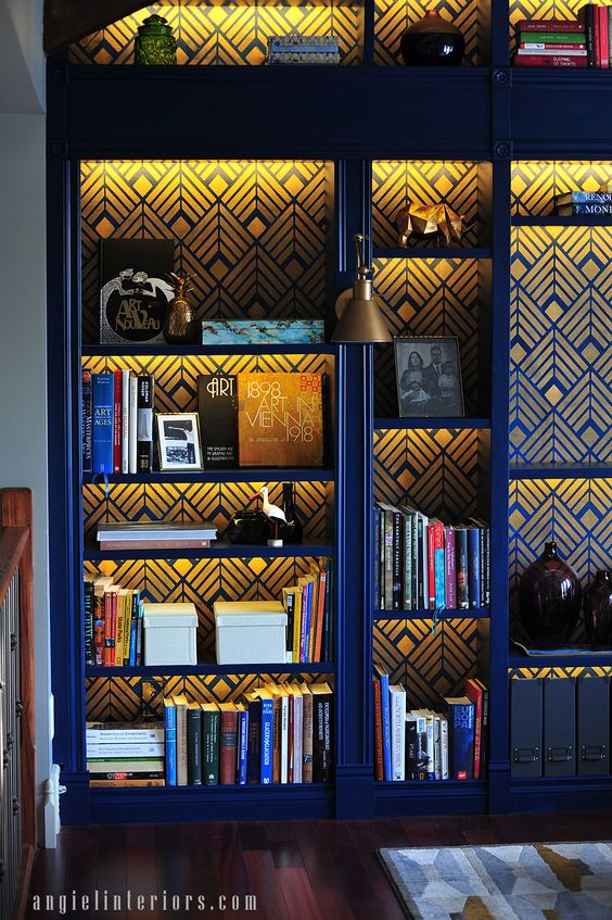 A cobalt blue and gold library bookcase using the Deco Diamonds Wall Stencil  from Cutting Edge Stencils on an Ikea Billy Bookcase. Project by Anna Angiel Interiors