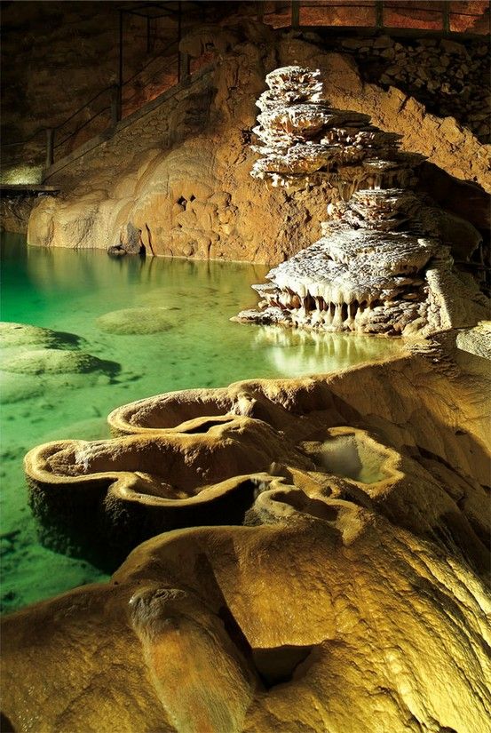 Padirac Cave, France. The most amazing cave structure, and you go in a boat to visit it!