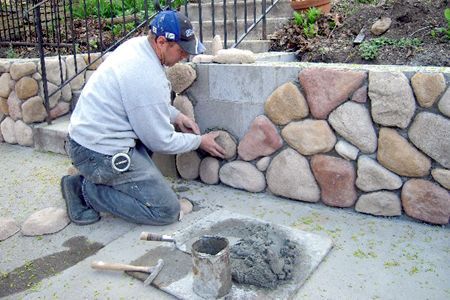 cobblestone and stucco homes | Masonry touches to your home's exterior, such as a retaining wall, can ...