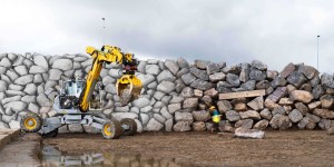 Autonomous Excavator Builds Stone Retaining Wall (Video)