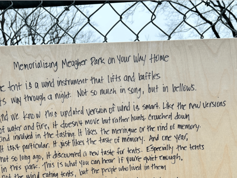 A poem written on a board and attached to a fence. The title is "Memorializing Meagher Park on Your Way Home." The poem is by Sue Goyette, HRM Poet Laureate