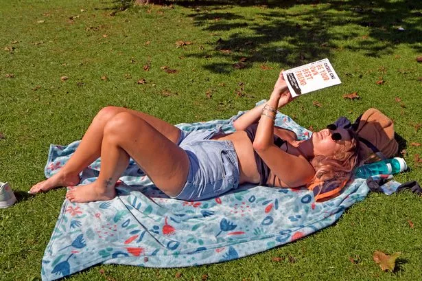 People enjoying the sunny weather in St Andrews Park, Bristol