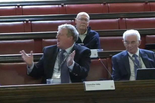 Cllr Richard Eddy speaking expressively at council meeting