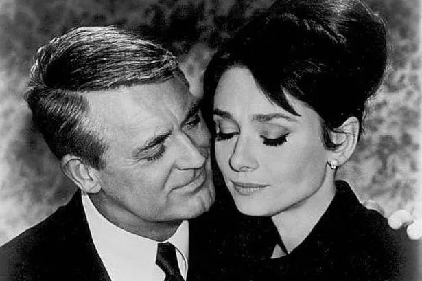 Cary Grant and Audrey Hepburn in a still from the movie Charade.