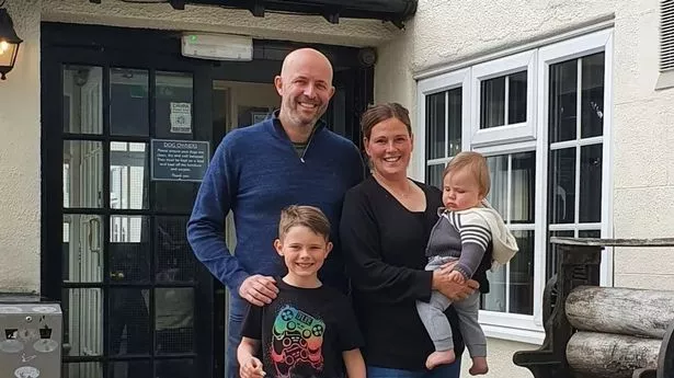 The family in front of the pub