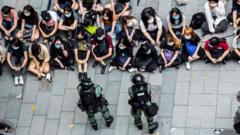 Riot police detain a group of people during a protest in the Causeway Bay district of Hong Kong