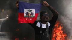 A demonstrator holds up a Haitian flag during a protest against Prime Minister Ariel Henry's government and insecurity, in Port-au-Prince, Haiti on 1 March 2024