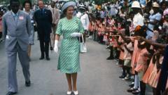 Queen Elizabeth ll is greeted by the public during a walkabout in Barbados on November 01, 1977 in Barbados