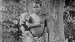 Ota Benga pictured holding a monkey in the US