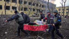 Iryna Kalinina (32), an injured pregnant woman, is carried from a maternity hospital that was damaged during a Russian airstrike in Mariupol, Ukraine, 09 March 2022.