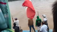 This picture taken from the boat shows some of the protesters