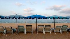 Empty chairs at a Thai beach