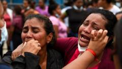 Family members react outside the Penitenciaria del Litoral prison where inmates were killed and injured in overnight violence, in Guayaquil, Ecuador, 13 November 2021