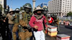 Beekeepers who demanded government measures to face the persistent drought that affects the country are detained by riot police after they blocked the street with honeycombs full of bees in front of the Chilean presidential palace, in Santiago, Chile, on 3 January 2022