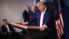 President Donald Trump speaks from the press briefing room with members of the White House coronavirus Task Force (1 April).