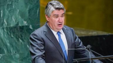 Croatian President Zoran Milanovic speaking in front of a group of people at the UN