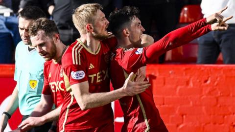 Aberdeen's Jamie McGrath celebrates with Richard Jensen as he scores to make it 2-1 during a cinch Premiership match between Aberdeen and Ross County at Pittodrie Stadium, on March 30, 2024, in Aberdeen, Scotland.