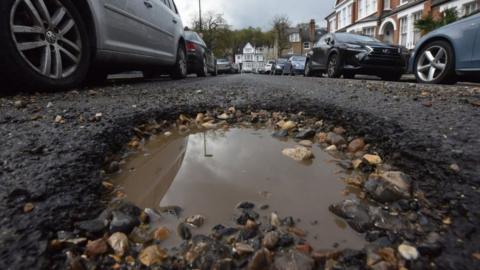 A pothole in a suburban road