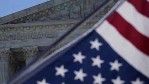 A US flag outside the Supreme Court in Washington, 25 June