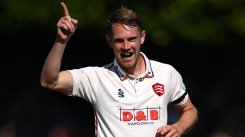 Jamie Porter celebrates taking a wicket for Essex against Middlesex