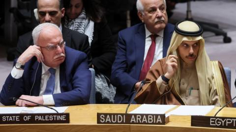 File photo showing Palestinian Foreign Minister Riyad al-Malki (L) and Saudi Foreign Minister Prince Faisal bin Farhan (R) sitting beside each other at a meeting of the UN Security Council in New York (29 November 2023)