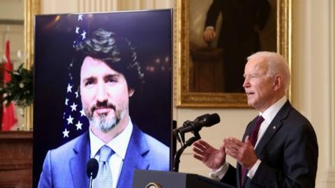 U.S. President Joe Biden and Canada's Prime Minister Justin Trudeau, appearing via video conference call, give closing remarks at the end of their virtual bilateral meeting from the White House in Washington