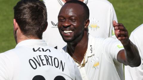 Kemar Roach takes a wicket for Surrey
