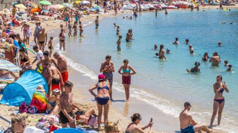 crowded beach in Corfu