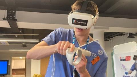 Medical student William Godfrey using the VR headset