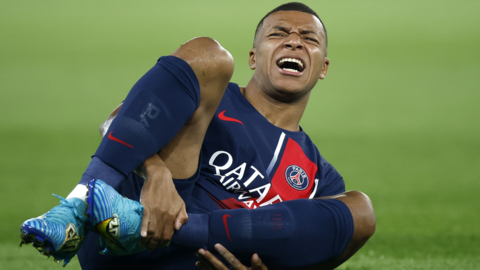 Kylian Mbappe goes down holding his ankle in the Ligue 1 match against Marseille