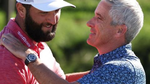 Jon Rahm is congratulated by PGA Tour commissioner Jay Monahan after winning last year's Tournament of Champions