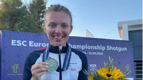 Shooter Lucy Hall with her silver medal