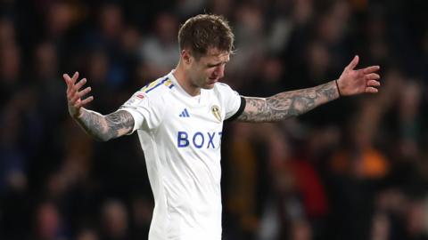 Leeds United defender Joe Rodon reacts after being sent off against Hull City in the Championship
