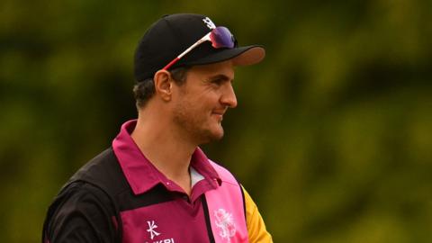 Jack Brooks celebrates a team-mate taking a wicket for Somerset