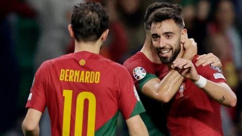 Bruno Fernandes celebrates scoring for Portugal against Iceland in Euro 2024 qualifying with Cristiano Ronaldo and Bernardo Silva