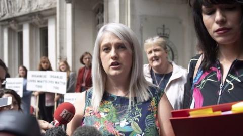 Sarah Ewart (centre) speaks outside Supreme Court London