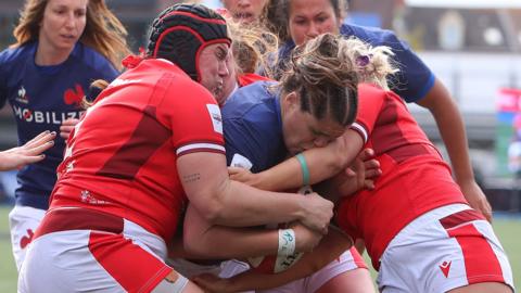 Wales players block France prop Annaelle Deshayes from scoring a try
