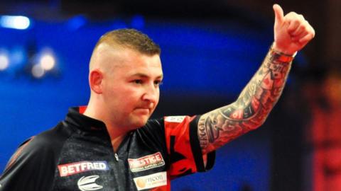 Nathan Aspinall celebrates winning the 2023 PDC World Matchplay in Blackpool