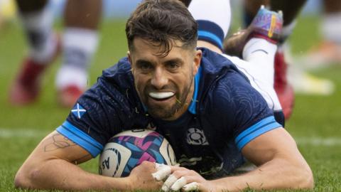 Adam Hastings scoring a try while playing for Scotland