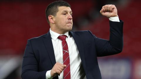 Matt Peet, Head Coach of Wigan, celebrates celebrates towards the fans during the Betfred Super League Final match between Wigan Warriors v Catalans Dragons at Old Trafford on October 14, 2023 in Manchester, England.