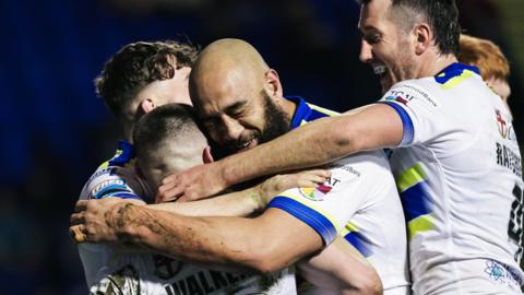 Warrington Wolves had been level on points with leaders Catalans Dragons before their win against Huddersfield on Saturday