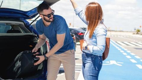 Man dropping woman off at airport