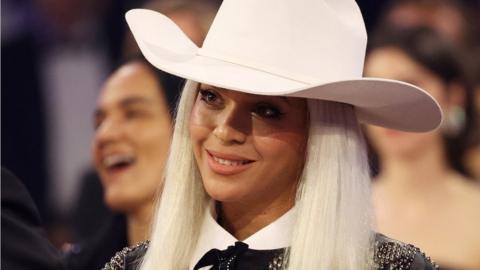 Beyonce wearing a white cowboy hat