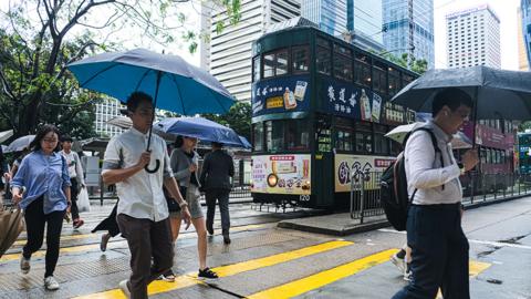 Pedestrians walk in central Hong Kong in October 2023
