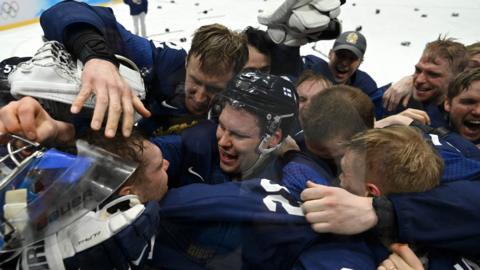 Finland celebrate their ice hockey gold