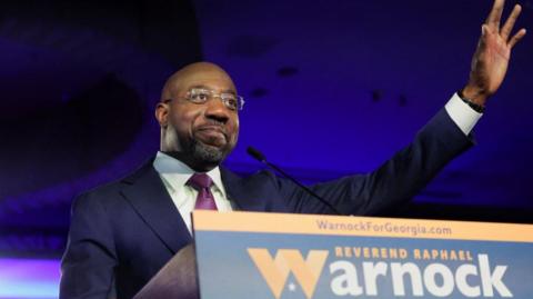 U.S. Senator Raphael Warnock (D-GA) speaks during an election night party after a projected win in the U.S. midterm runoff election